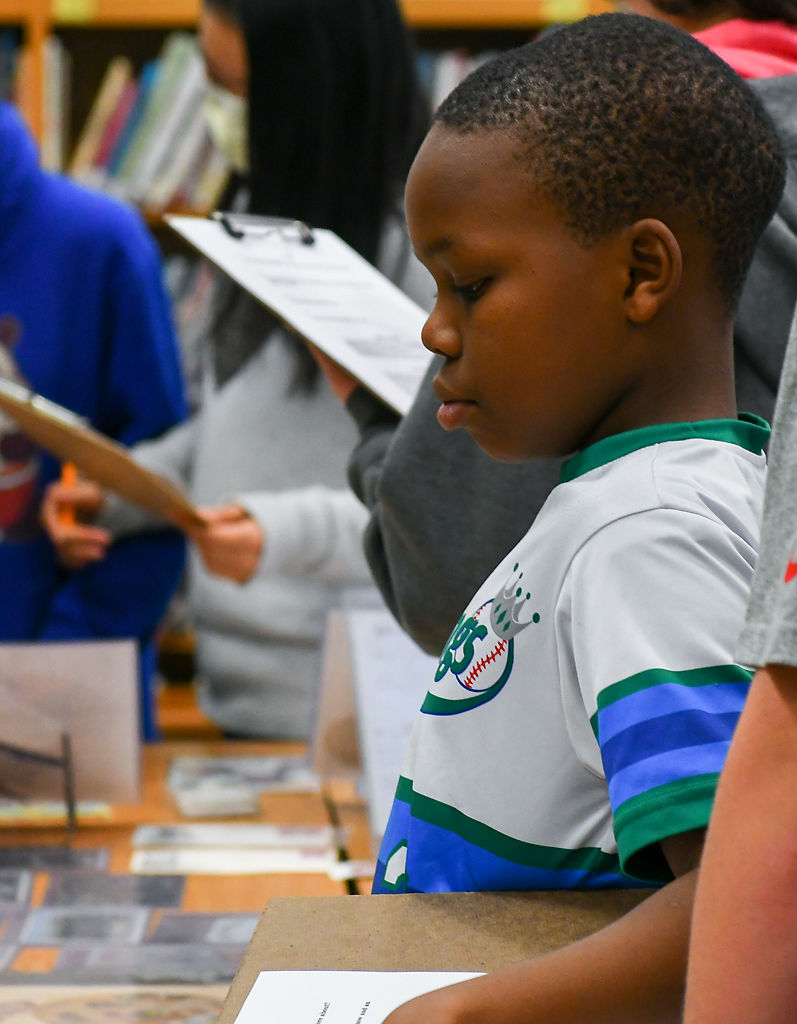 Alexander Brown views artifacts from the Black History 101 Mobile Museum
